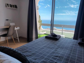 Modern open-plan studio with terrace and sea view